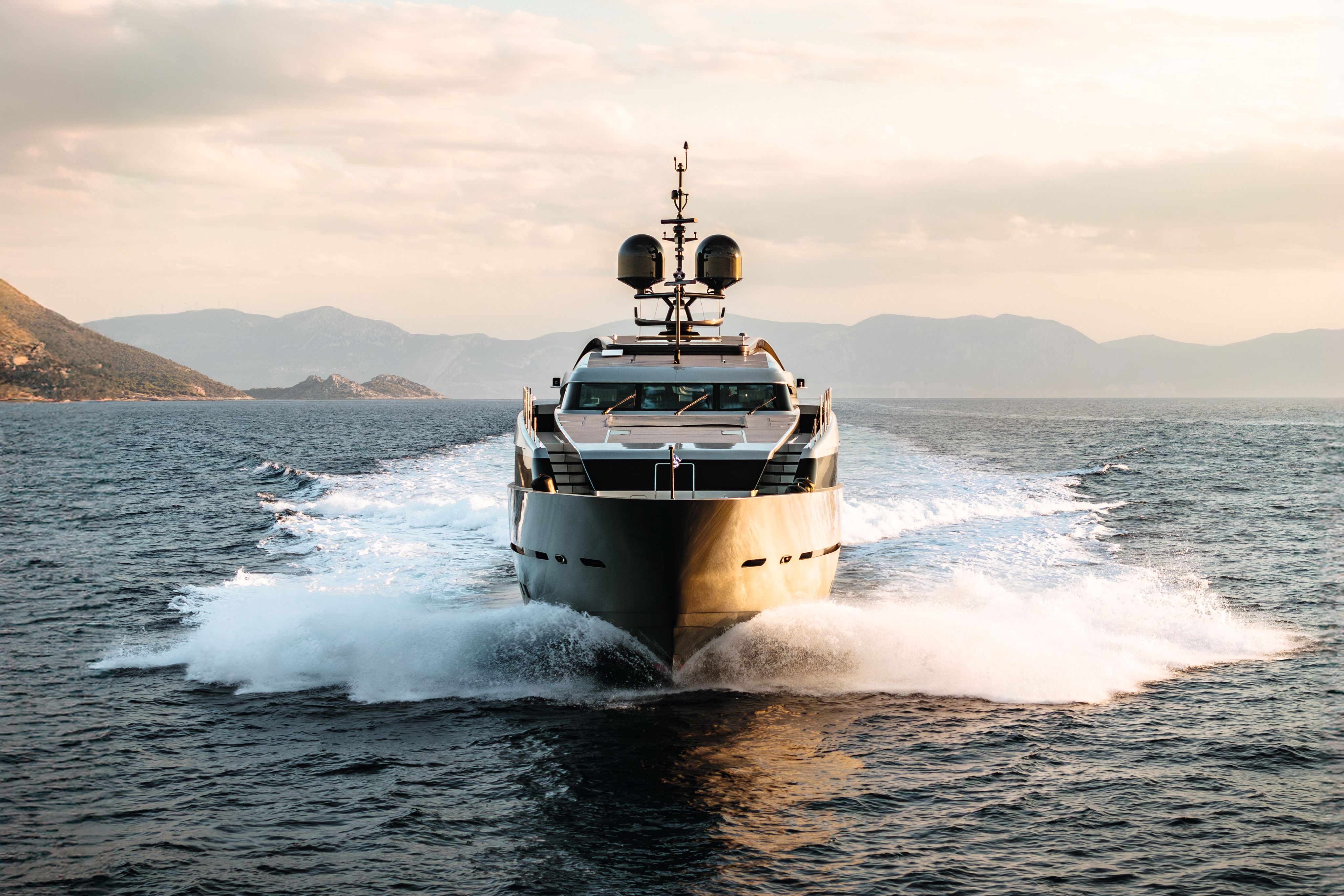 Naia on the water, shot from above, off the coast of an island