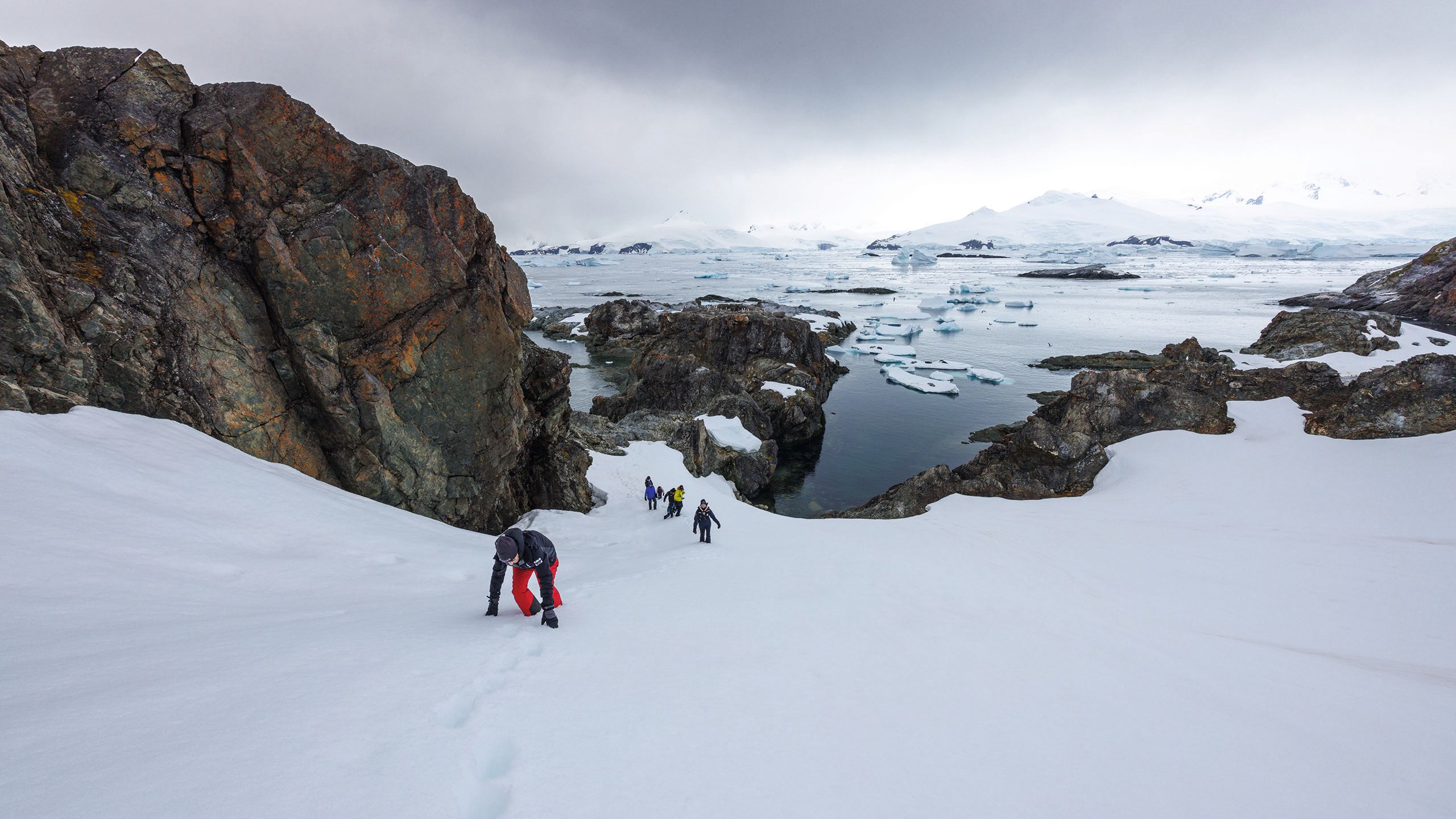 Group climb glacier