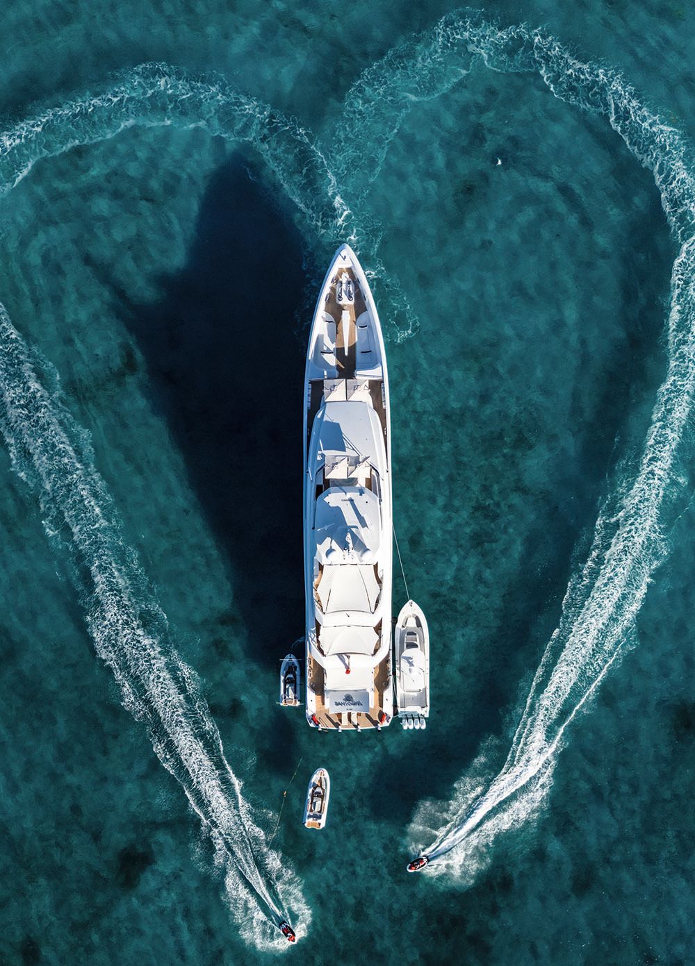 Overhead shot of Santosha. A heart has been drawn aound the boat in the waves
