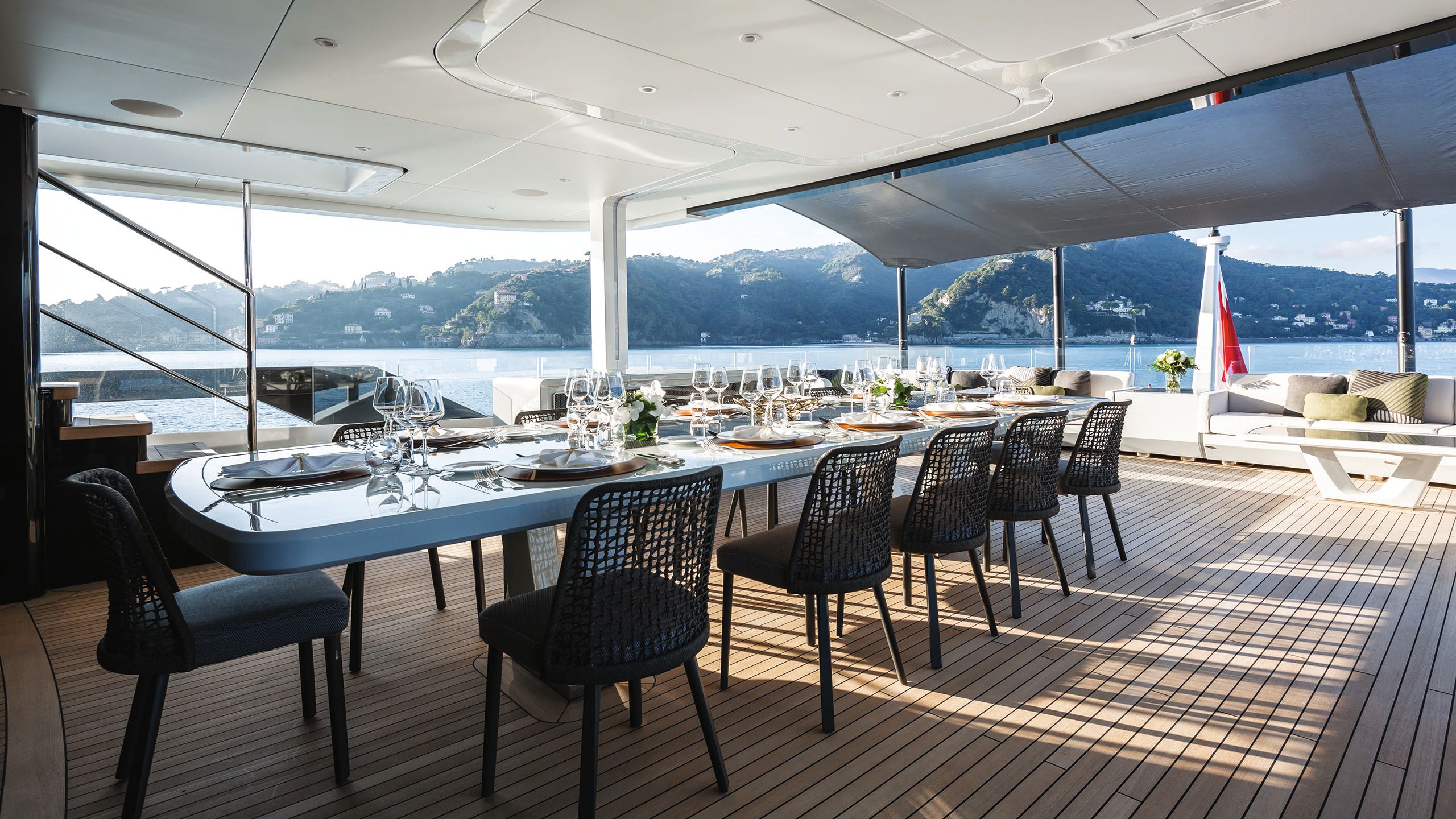 Large dining table on the deck set for 10 people