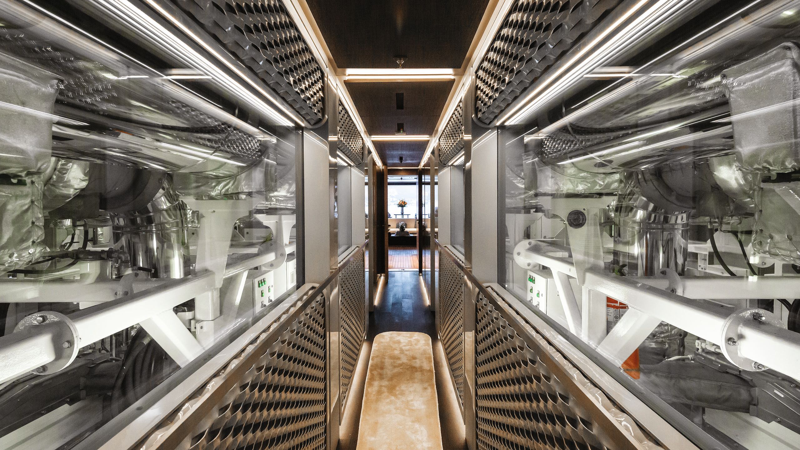The engine rooms flank either side of a glass-sided corridor