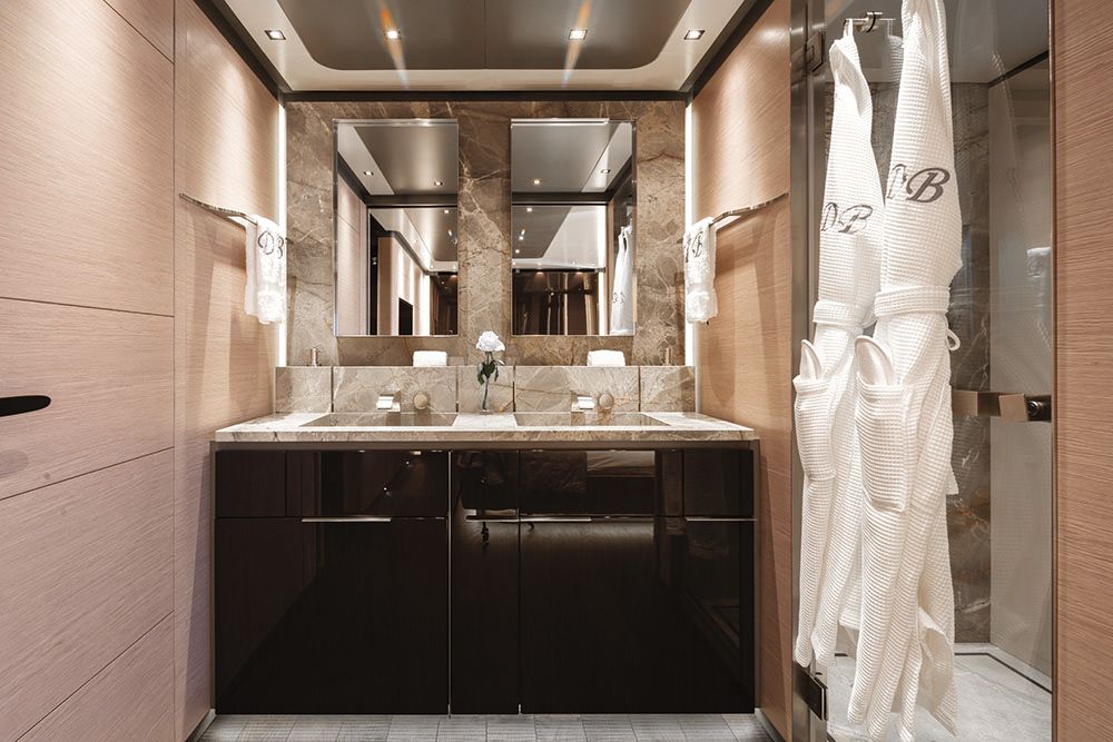 Marble, cream and brown bathroom with double vanity