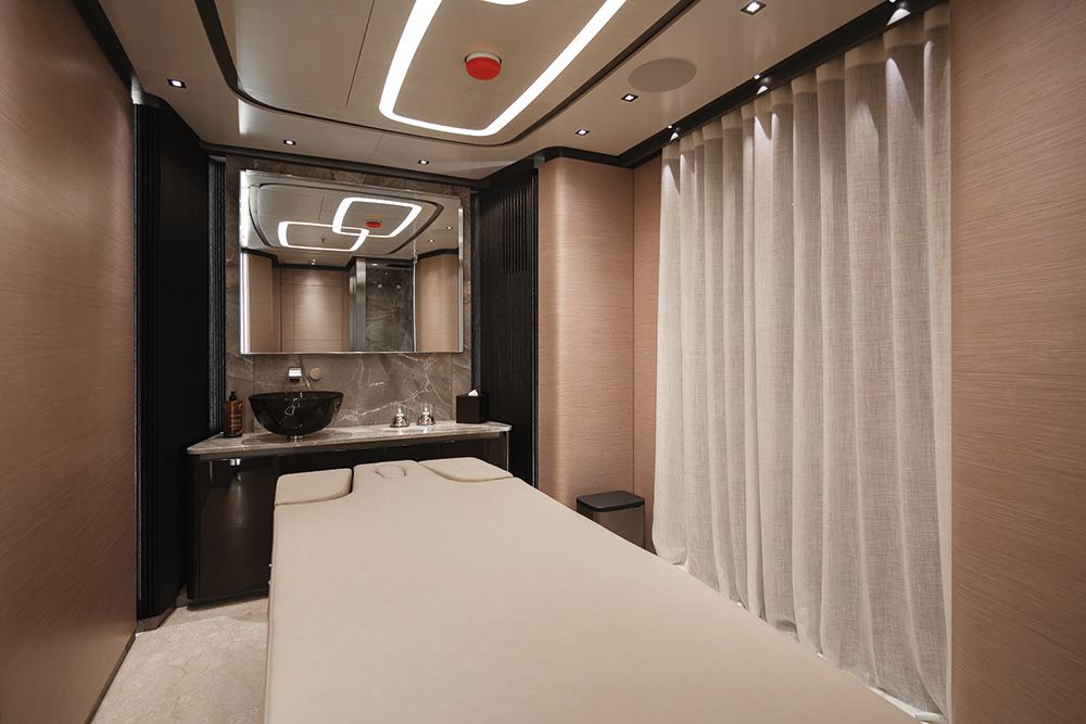 Neutral bathroom area with circular black basin on the counter