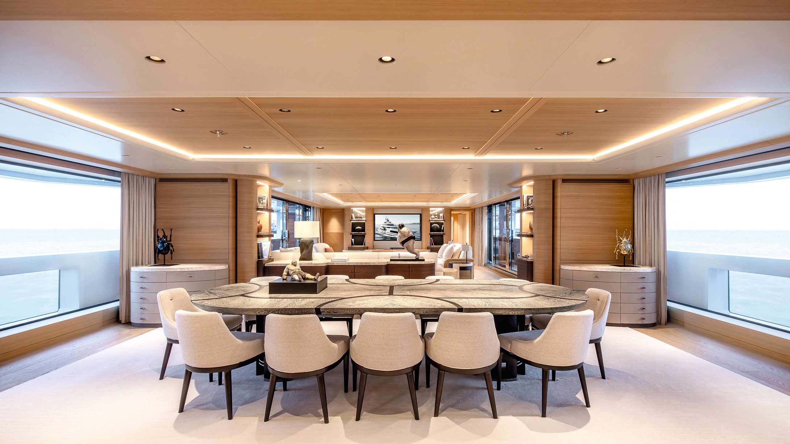 Inside a saloon, looking at a large dining table with seats for 12