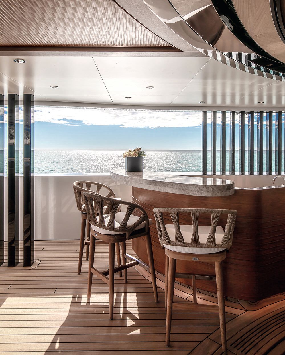 Bar area on a covered deck with two high chairs