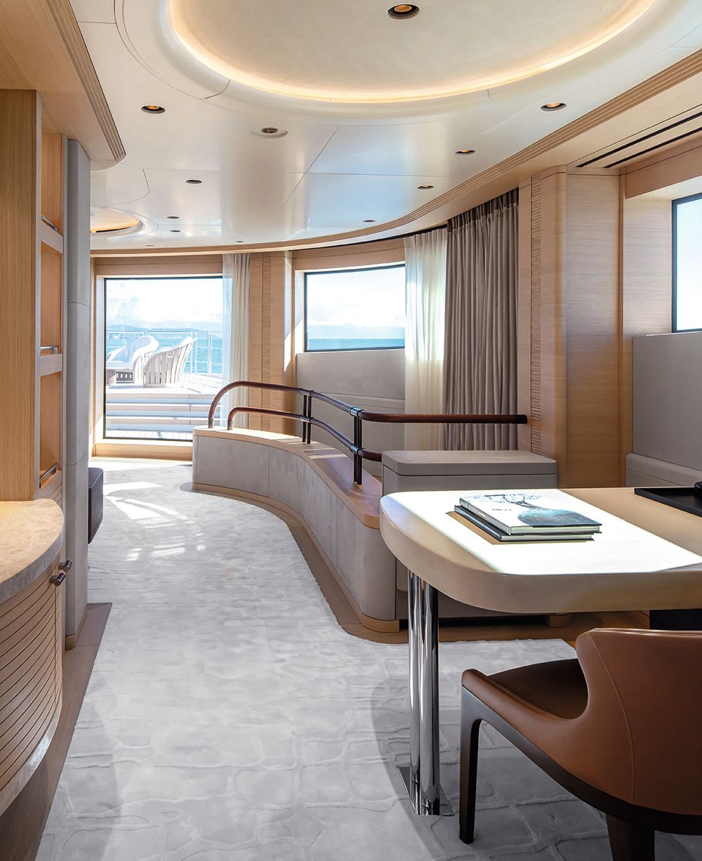 View looking down the side of the bedroom with a deck and chair off to the right