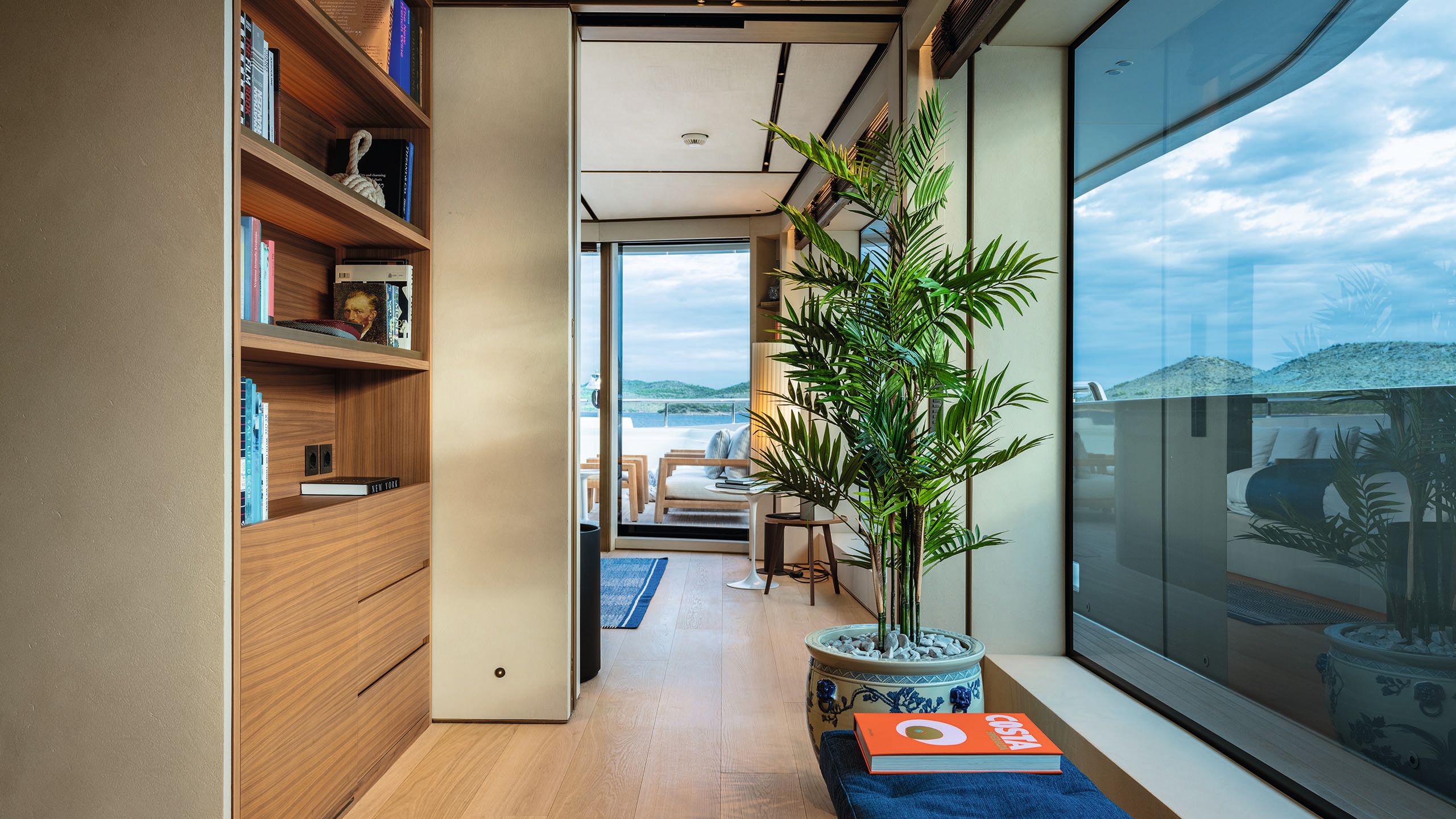 Looking down a passage into the office space, showcasing the large windows