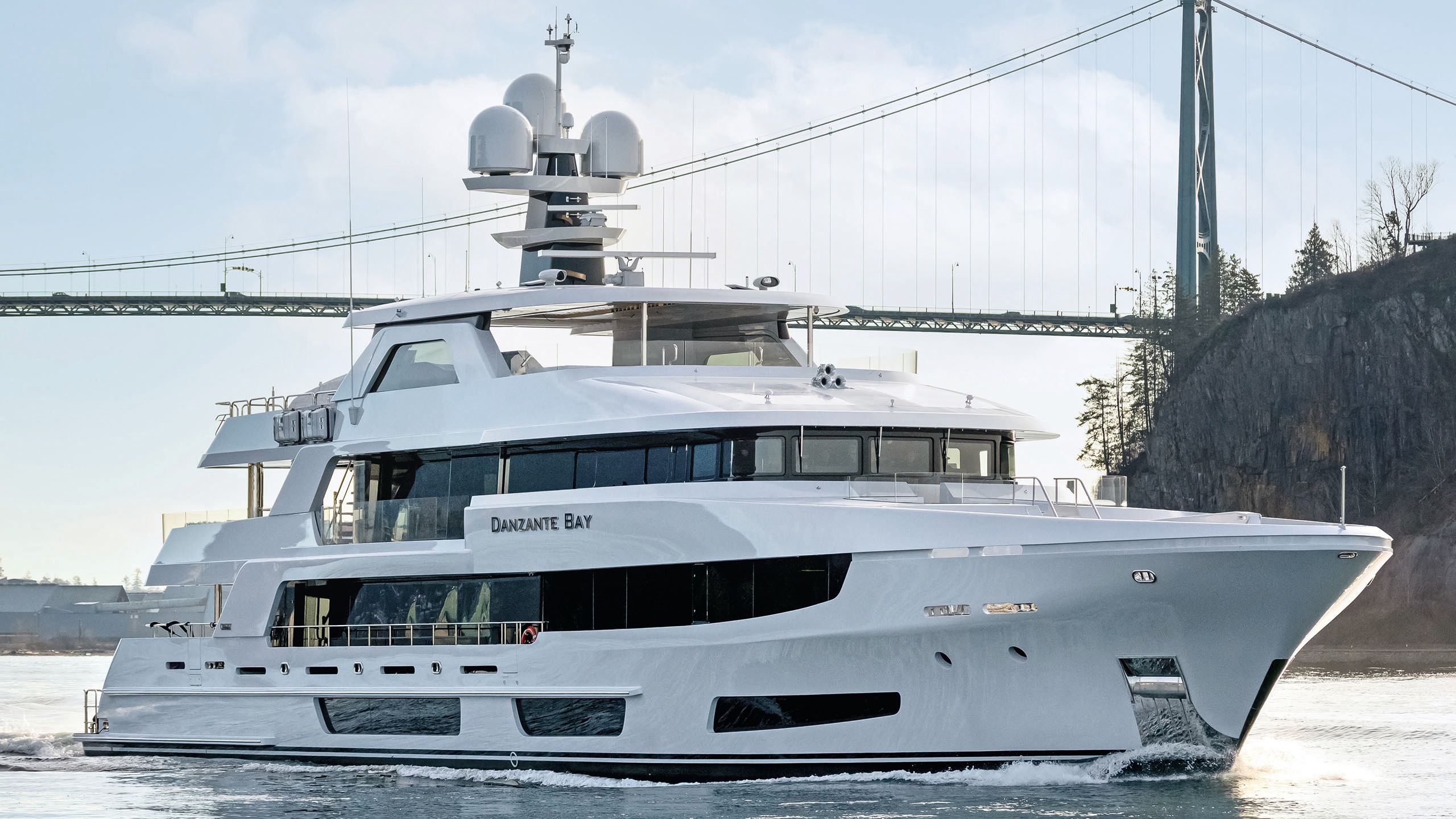 Danzante Bay from the side on the water with a bridge behind it