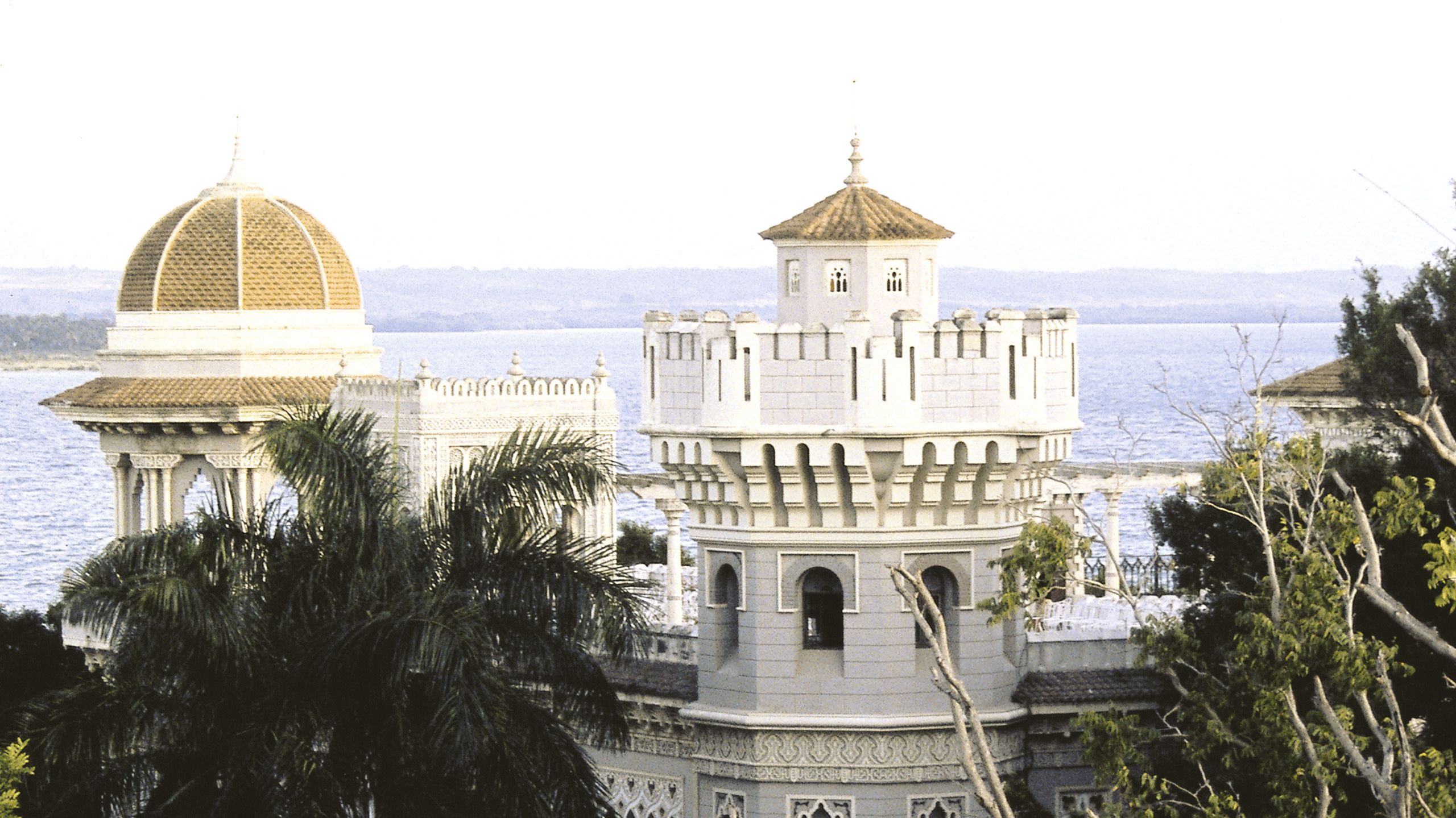 Exterior view of the Palacia de Valle - a white, ornate building with a yellow dome