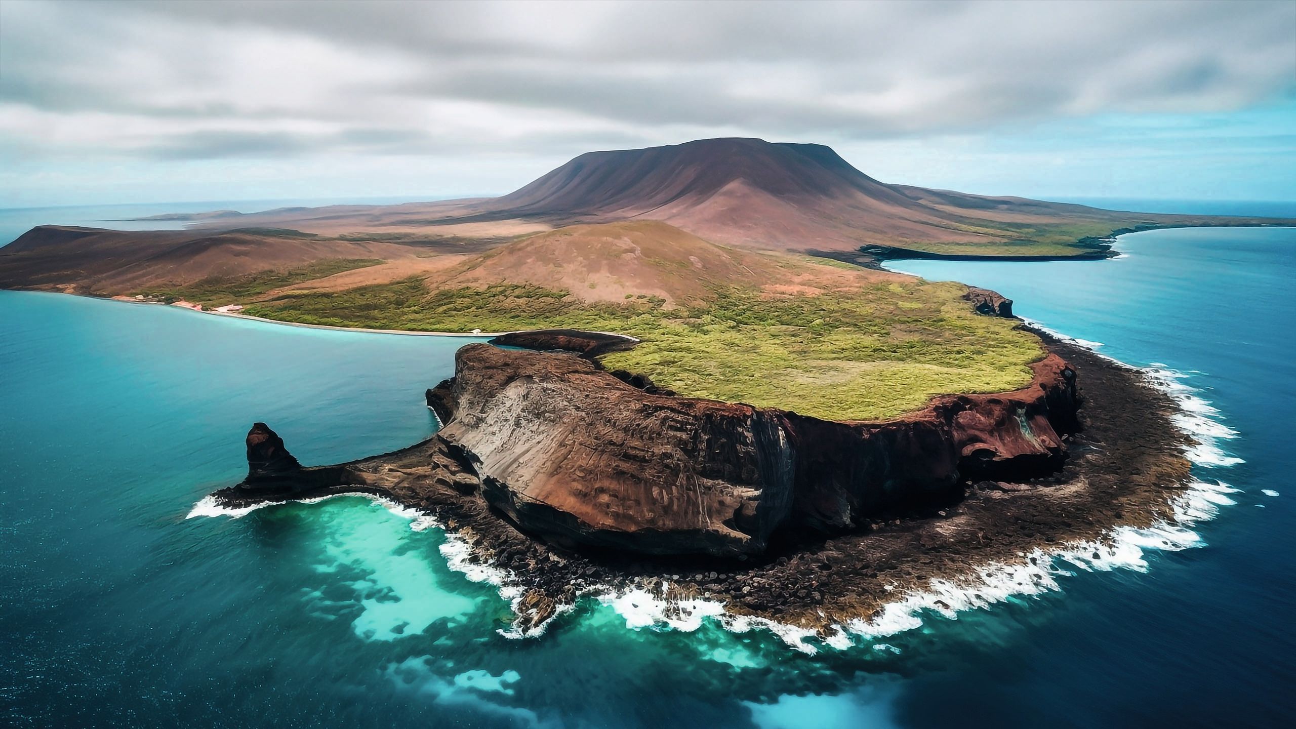 Overhead view of the Galapagos islands. The sea around is bright turquoise