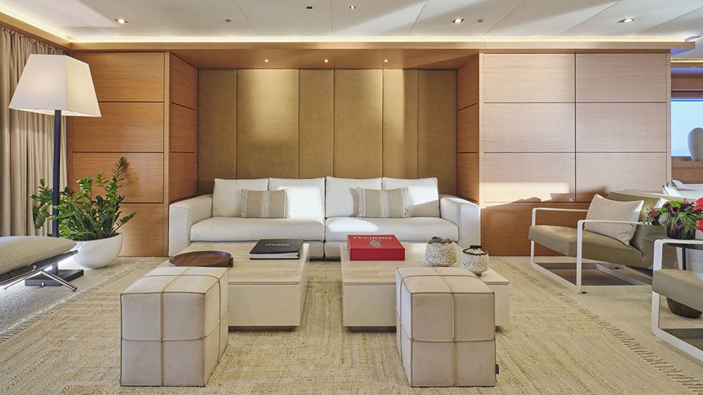 The main saloon has neutral decor including white and beige sofas