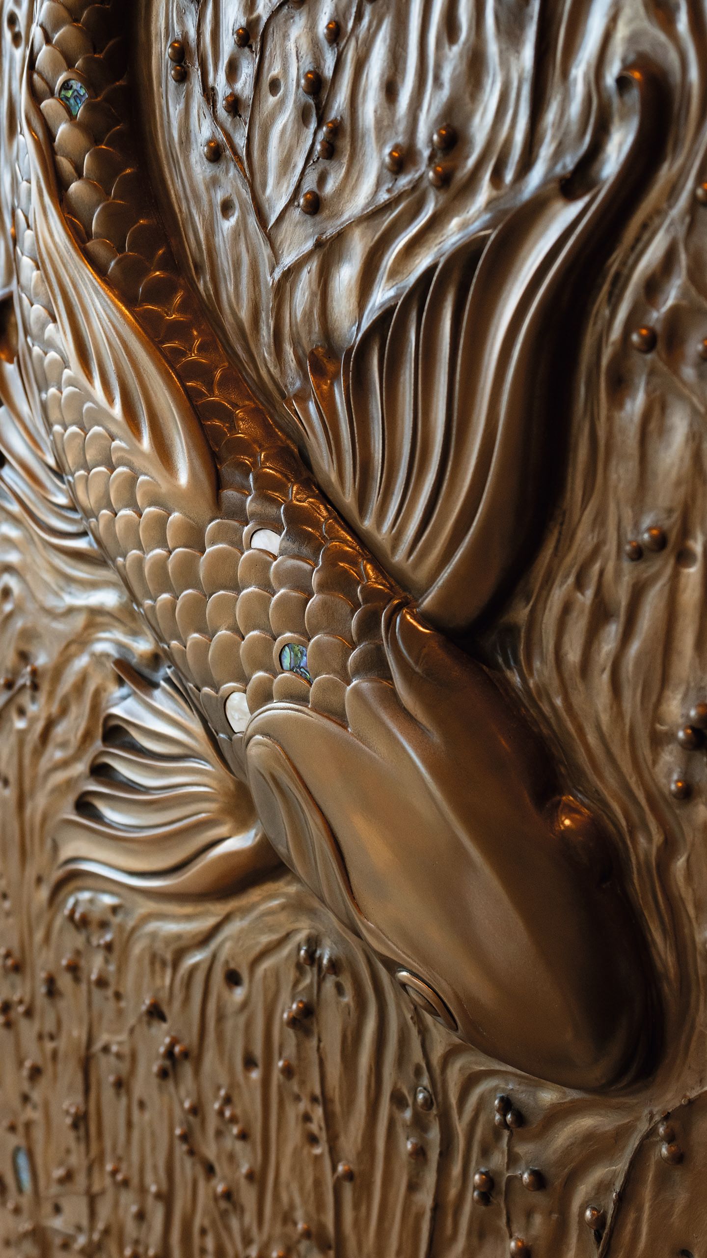 Close-up of relief fish artwork