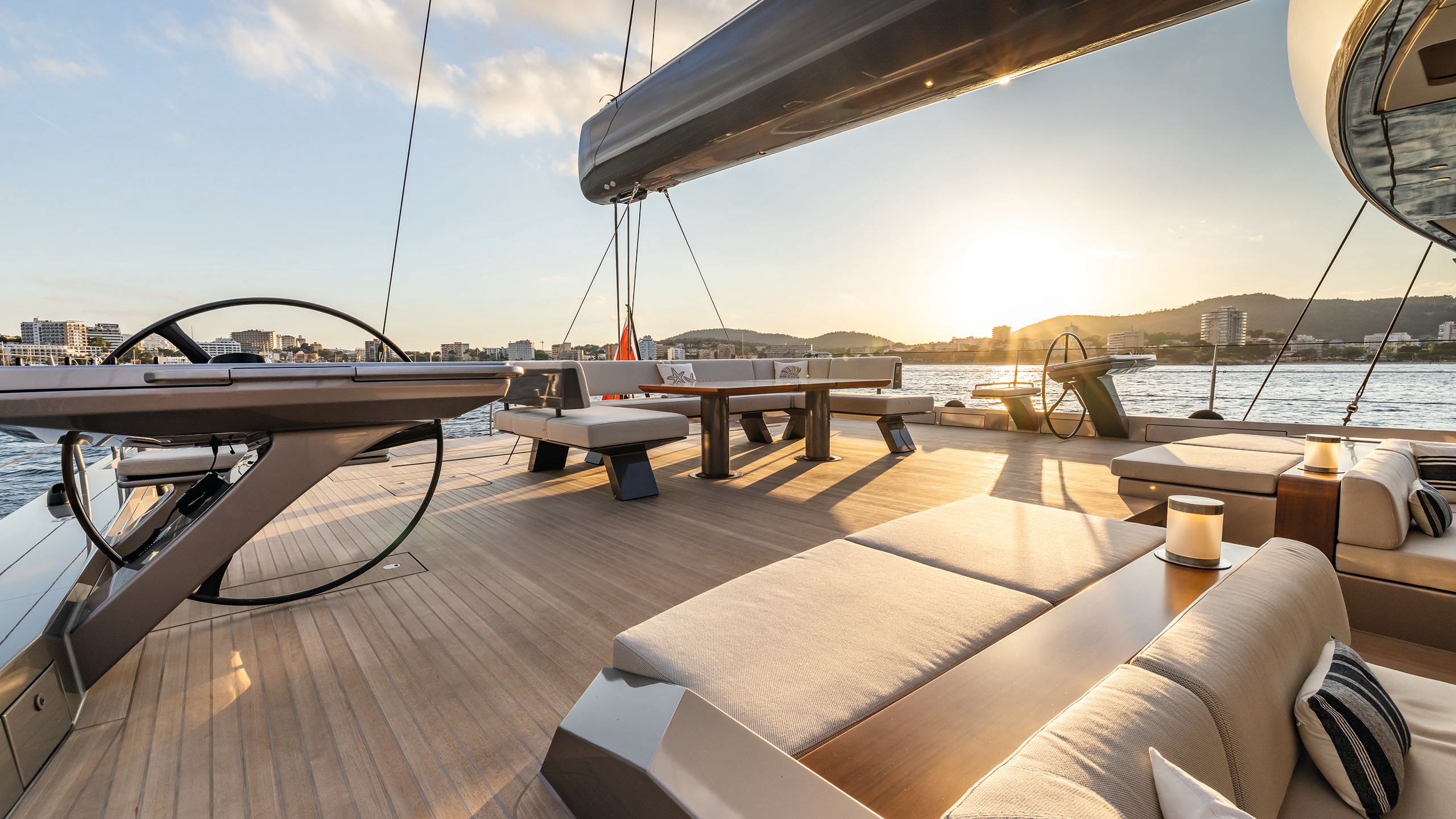 Al fresco dining and lounging area with seats for eating and large sunpads