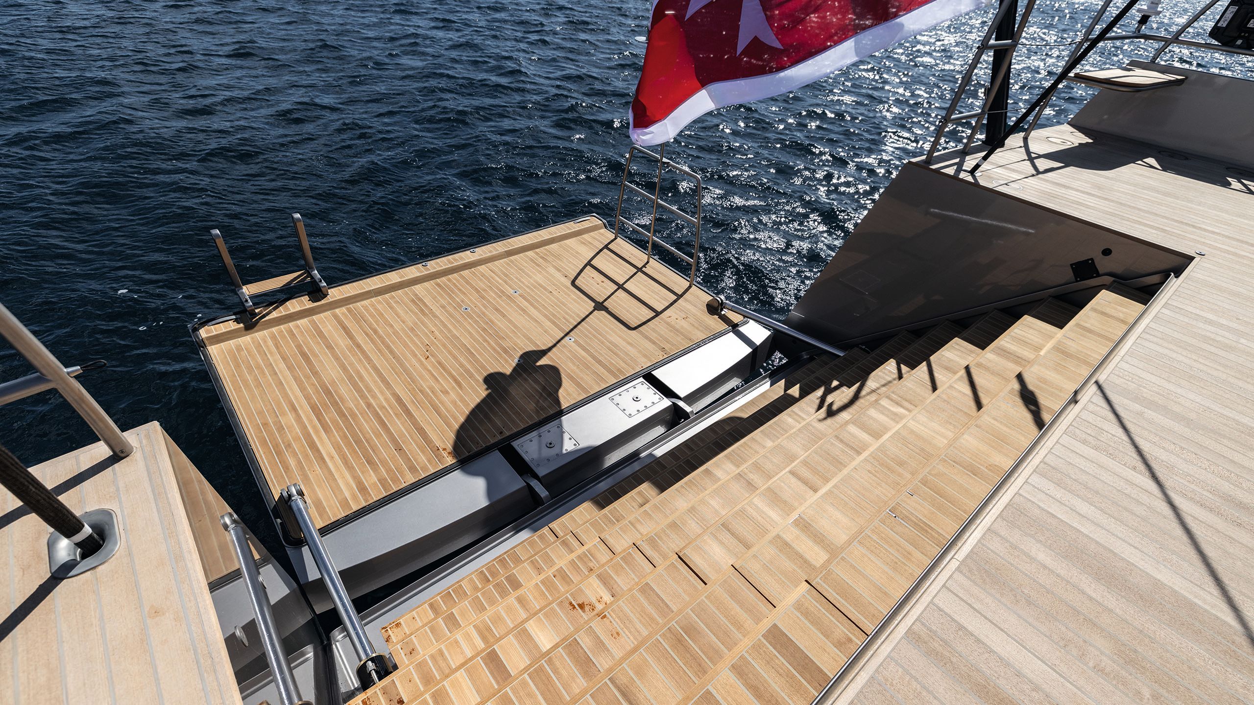 A view of the transom hatch from on board the boat, looking down the steps toward the ladder