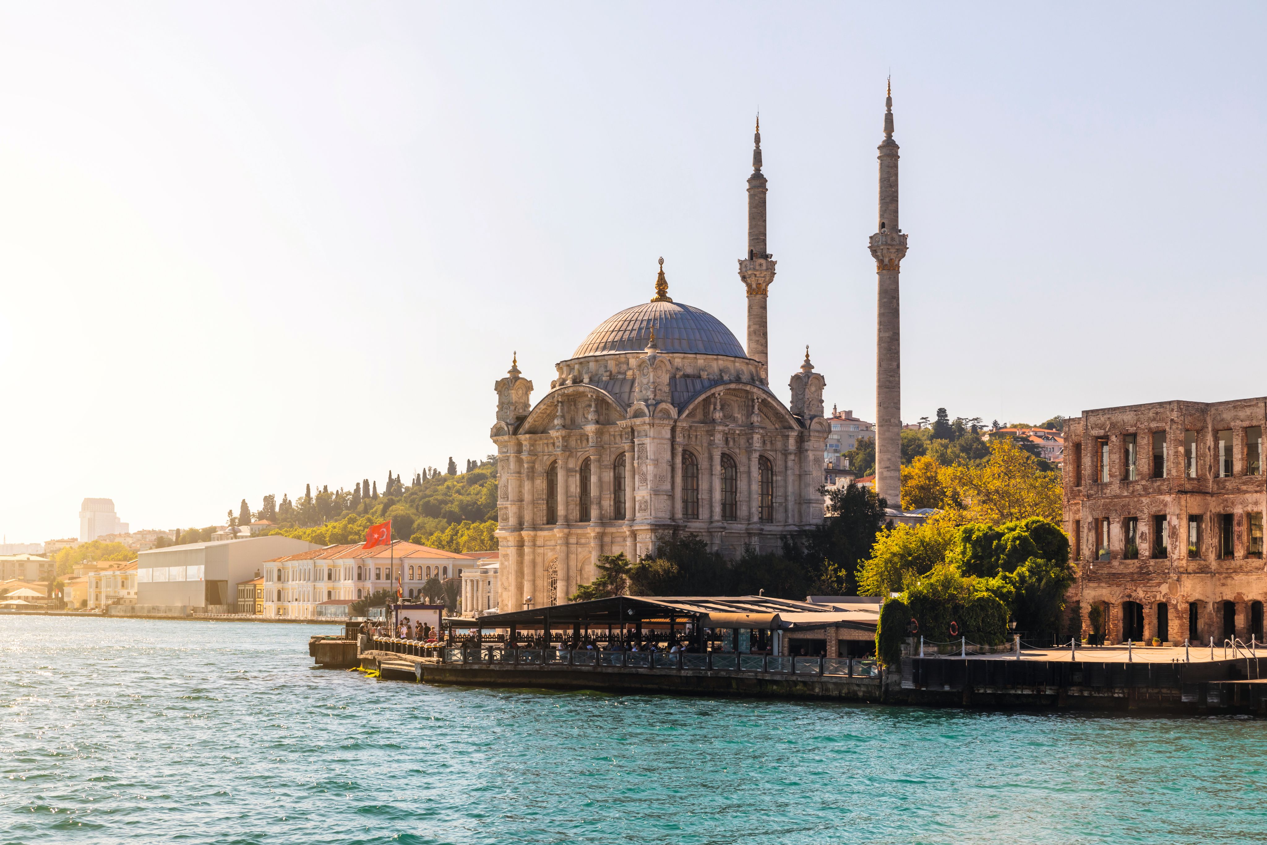 A large temple on the banks of a waterway in Istanbul