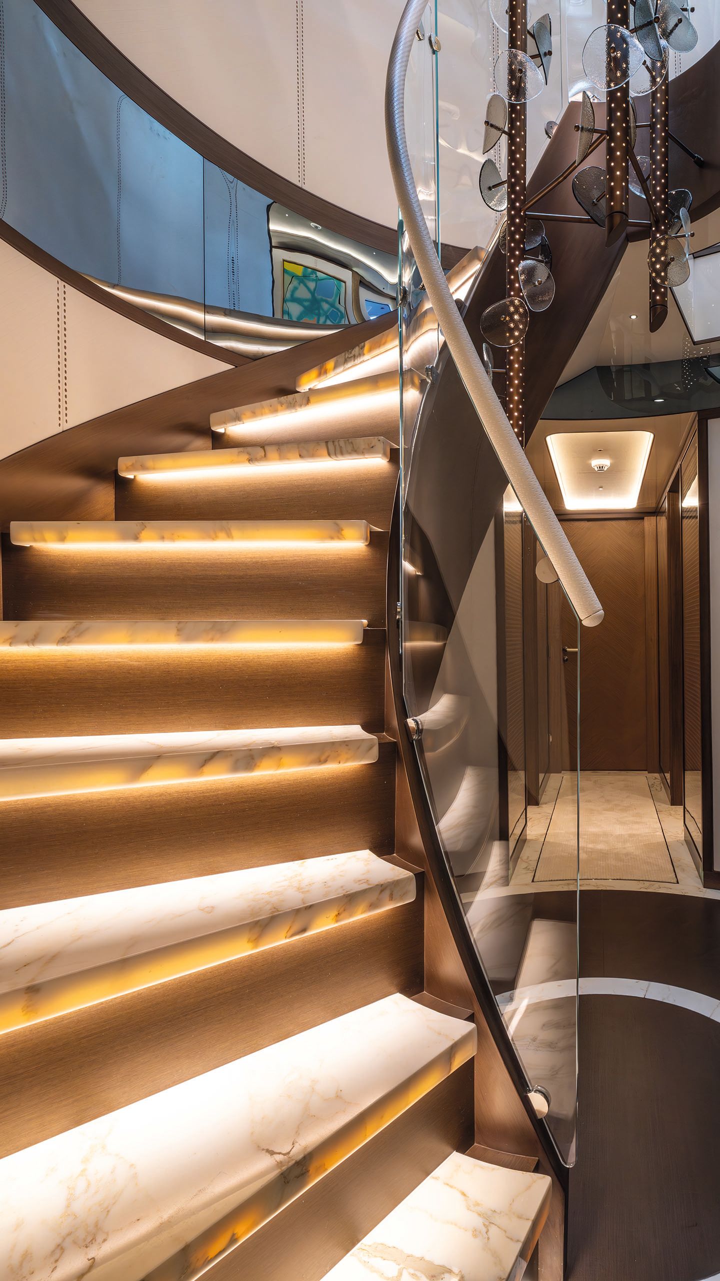 Close-up of the curved staircase which features treads lit from underneath