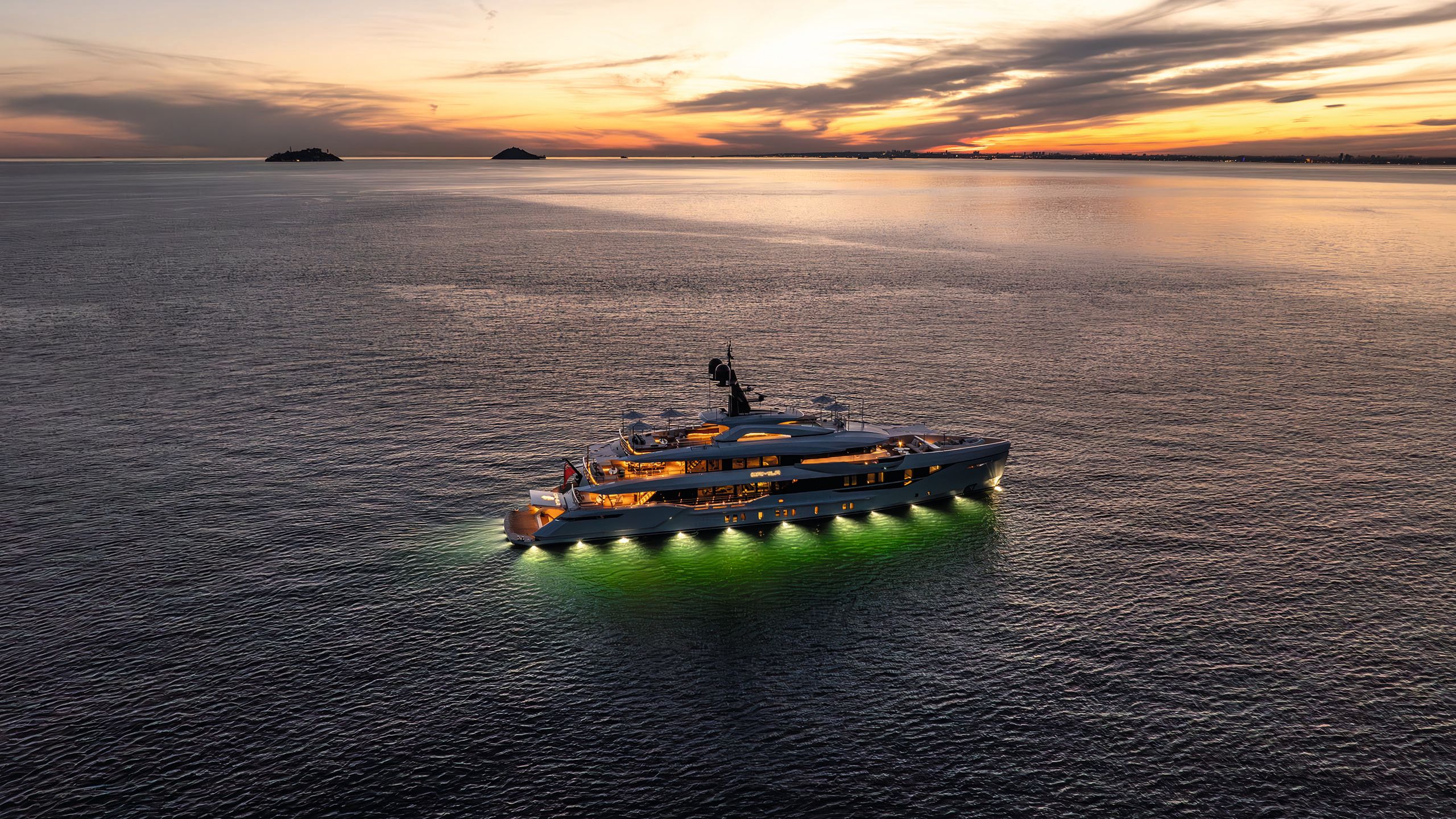 Wide shot of Camila on the water at night