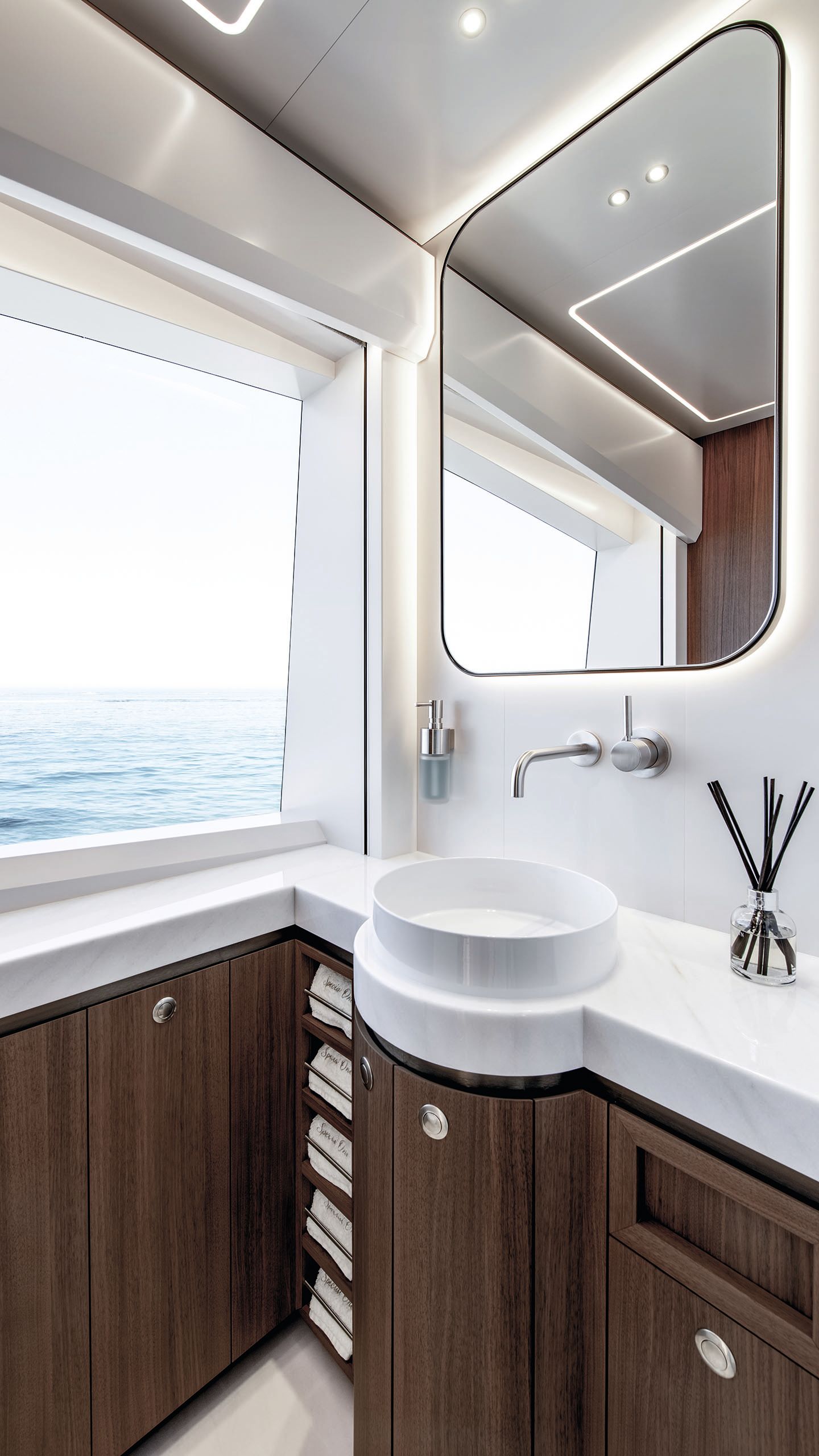 Circular, white marble sink and chrome tap