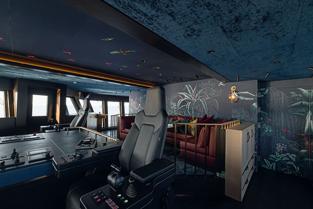 Wheelhouse with comfy seat and birds painted on ceiling