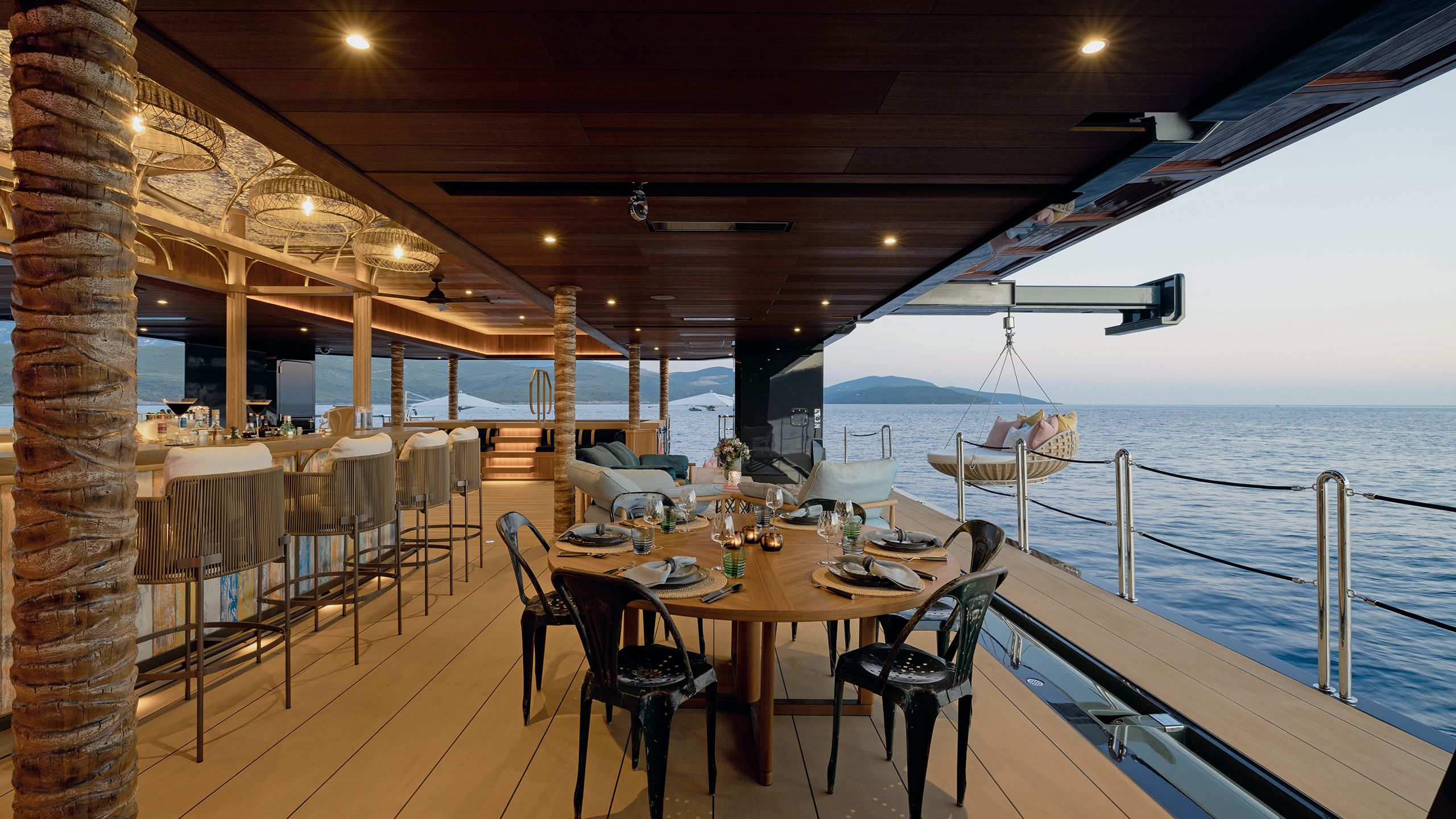 Exterior dining and bar space with swing