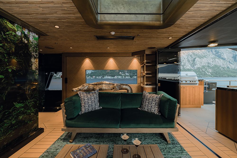 Green velvet sofa in lounge area