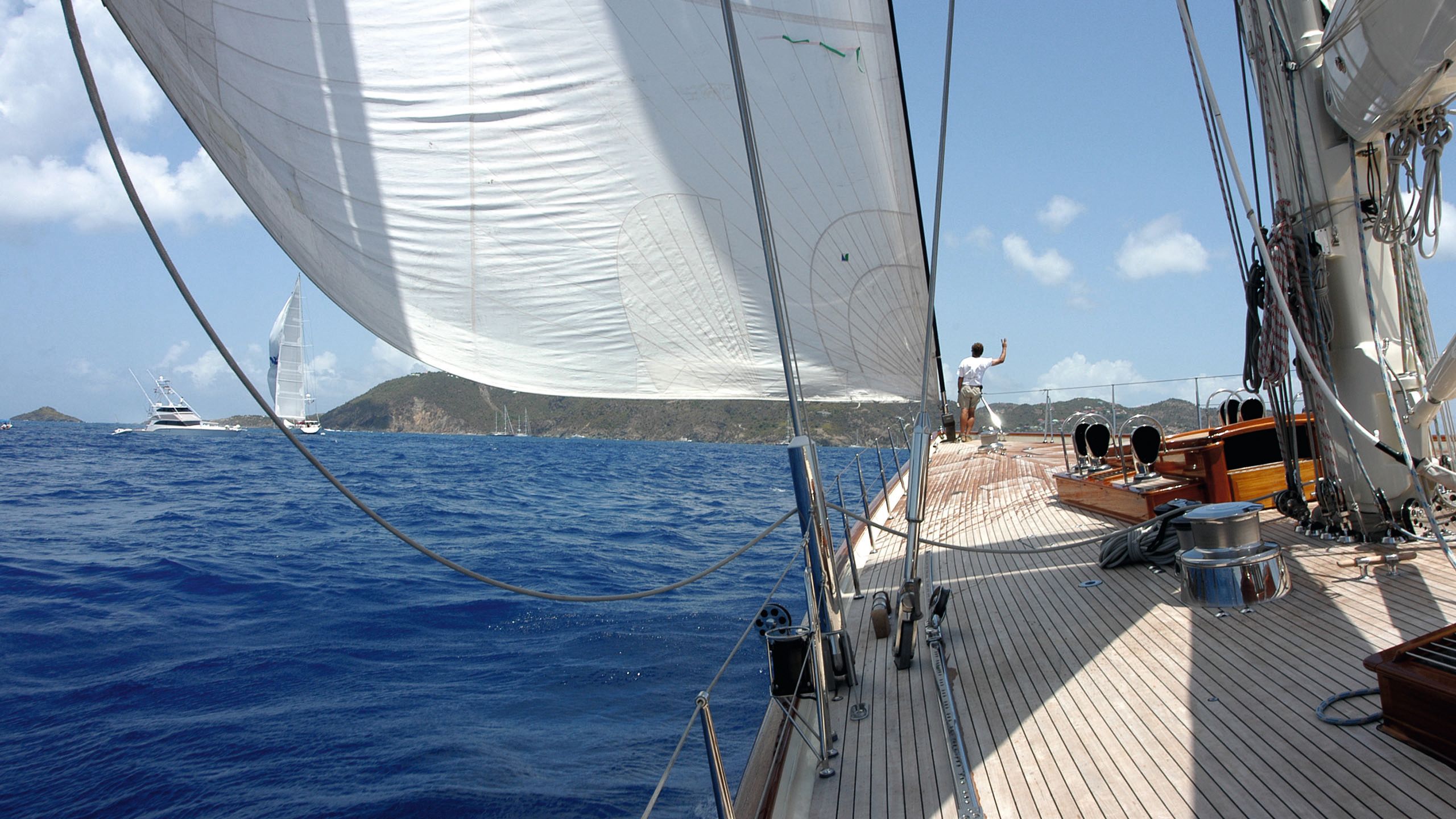 View looking down the deck of a sailboat on the water