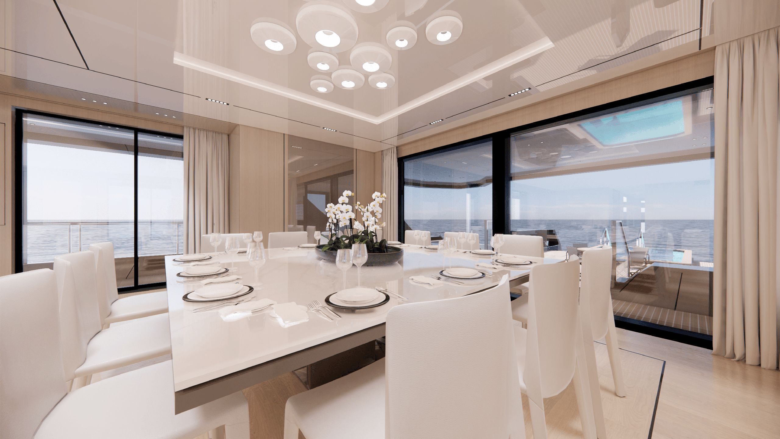 Dining room with set table and abstract glass light fixture overhead