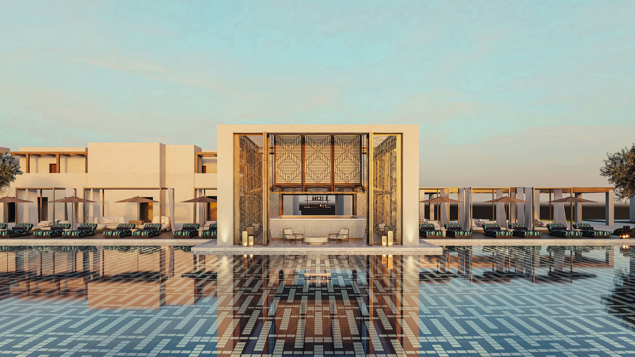 Wide shot across completely still infinity swimming pool with sun loungers and bar in background