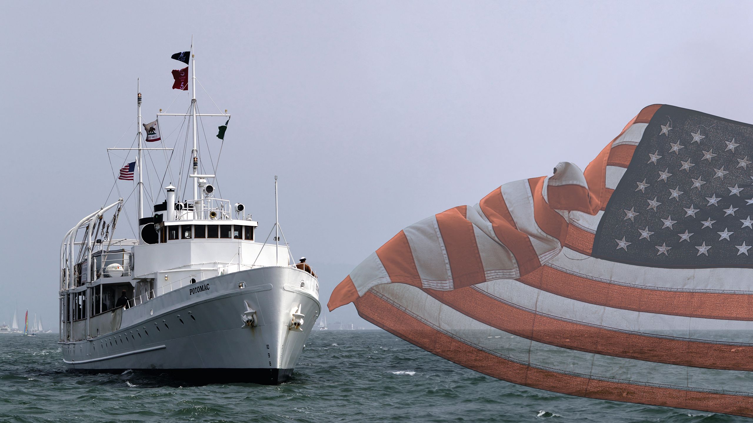 USS Potomac on the water, as taken from the front, with a US flag overlay